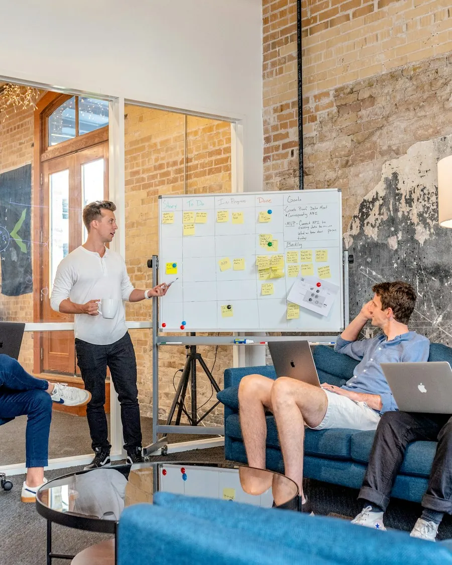 Team mapping a mobile app strategy on a whiteboard